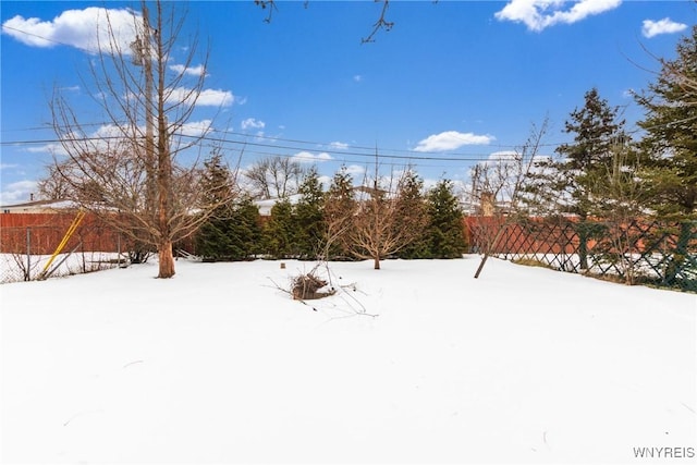 view of yard layered in snow