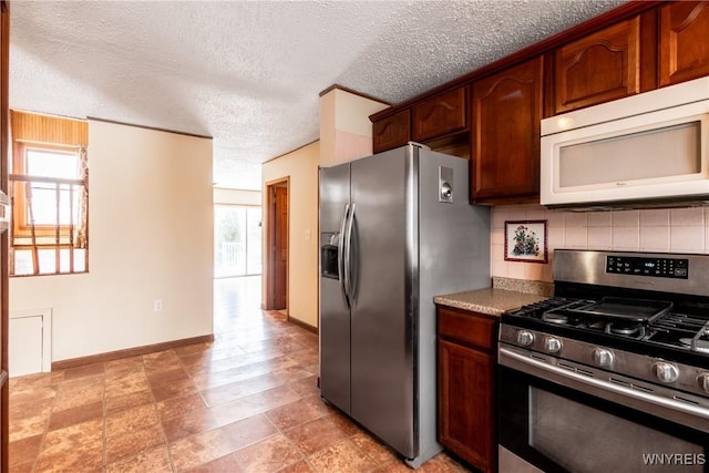 kitchen featuring tasteful backsplash, appliances with stainless steel finishes, and a textured ceiling