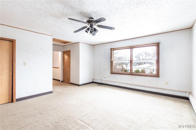 unfurnished room with light carpet, ceiling fan, a baseboard radiator, and a textured ceiling