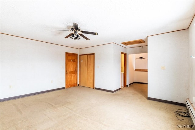 unfurnished room featuring crown molding, light colored carpet, ceiling fan, and a baseboard radiator