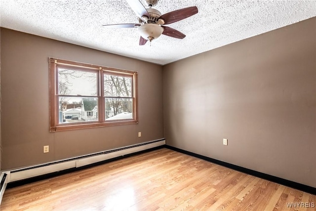 empty room featuring a baseboard radiator, ceiling fan, a textured ceiling, and light hardwood / wood-style flooring