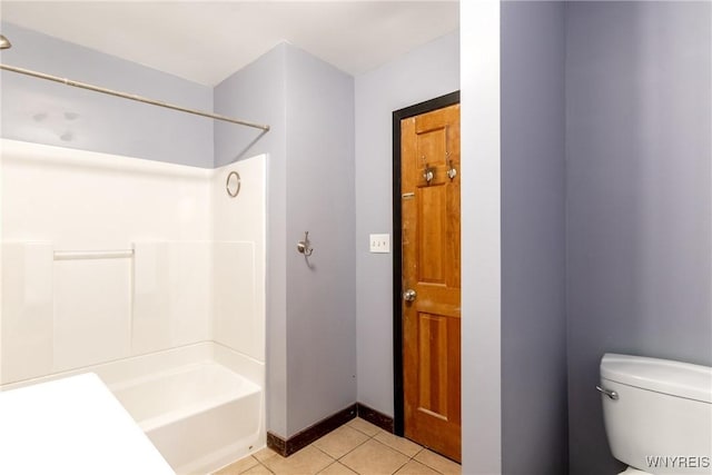 bathroom featuring tile patterned flooring,  shower combination, and toilet