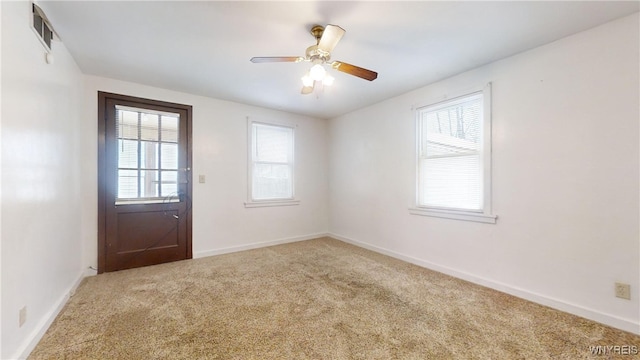 interior space with carpet and ceiling fan