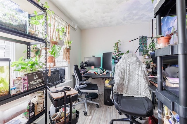 office area featuring cooling unit and wood-type flooring