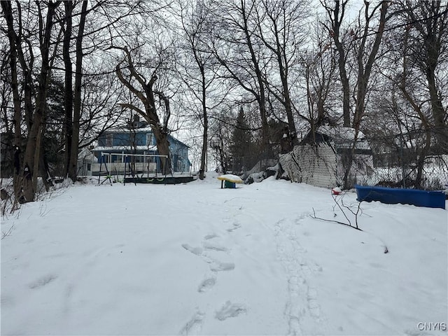 view of yard layered in snow