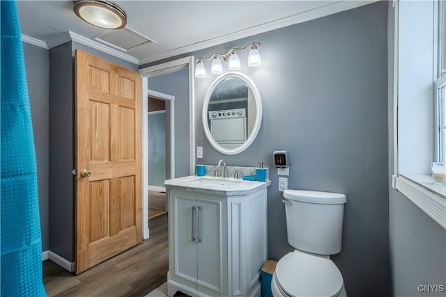 bathroom featuring vanity, hardwood / wood-style flooring, toilet, and crown molding