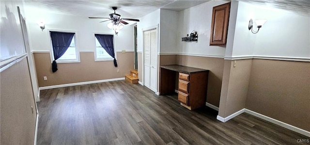 314 Stafford Ave, Marshall, NY 13480 - unfurnished dining area with dark wood-style flooring, ceiling fan, and baseboards