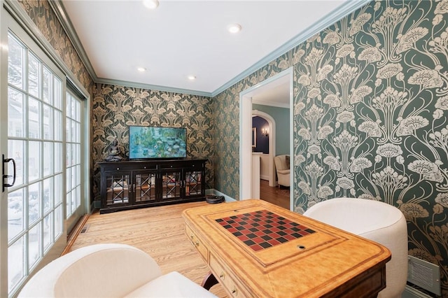 living room with crown molding and wood-type flooring