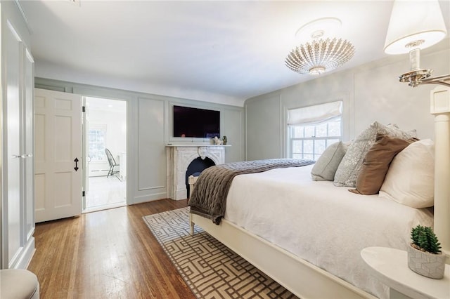 bedroom featuring multiple windows and wood-type flooring