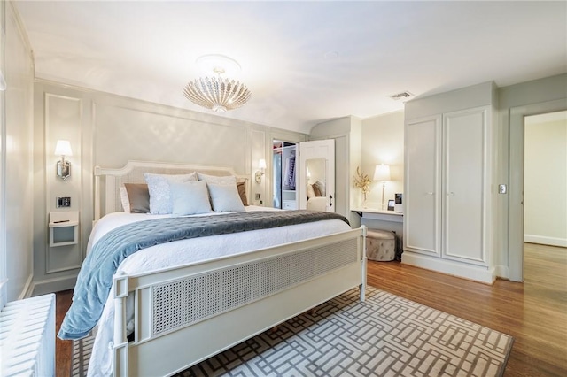 bedroom with hardwood / wood-style floors