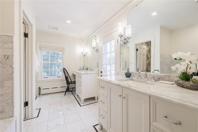 bathroom with vanity and a baseboard heating unit