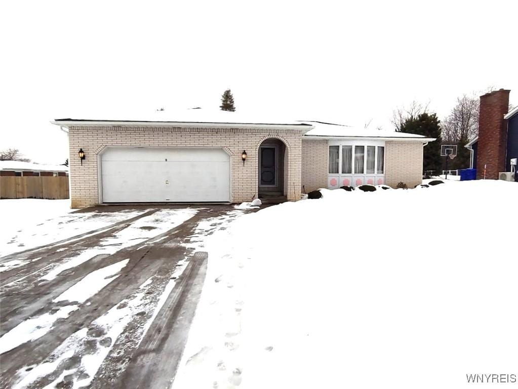 ranch-style home with a garage