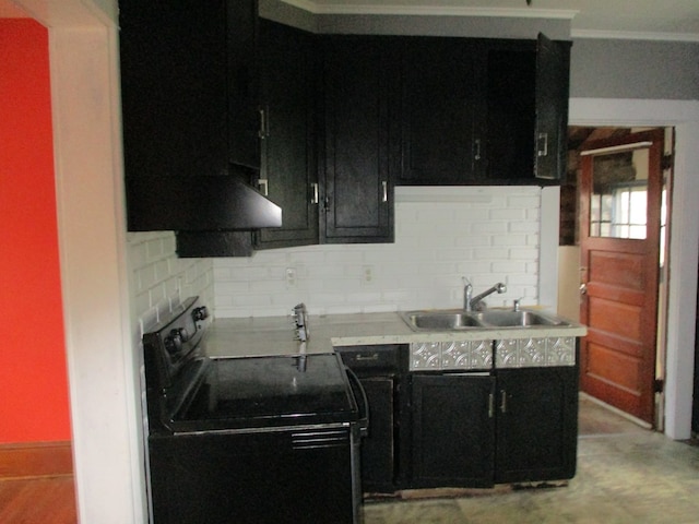 kitchen with black range with electric stovetop, backsplash, range hood, and sink