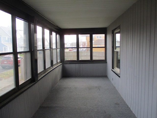 unfurnished sunroom with plenty of natural light