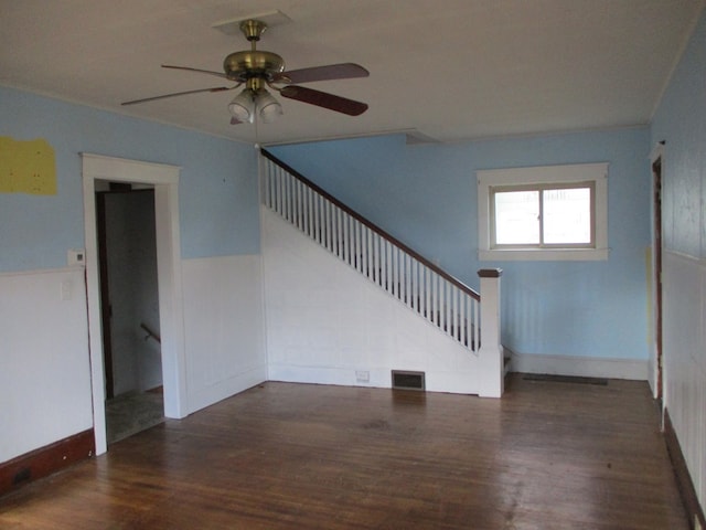 spare room featuring dark hardwood / wood-style floors and ceiling fan