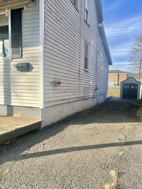 576 W High St, Erwin, NY 14870 - view of side of home with an outdoor structure and a shed