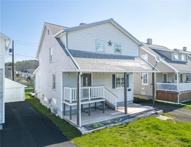 576 W High St, Erwin, NY 14870 - view of front of home with an outdoor structure, roof with shingles, a detached garage, and a porch