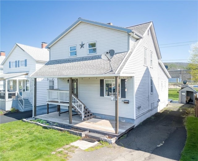 576 W High St, Erwin, NY 14870 - view of front of property featuring covered porch, a front yard, and a shingled roof