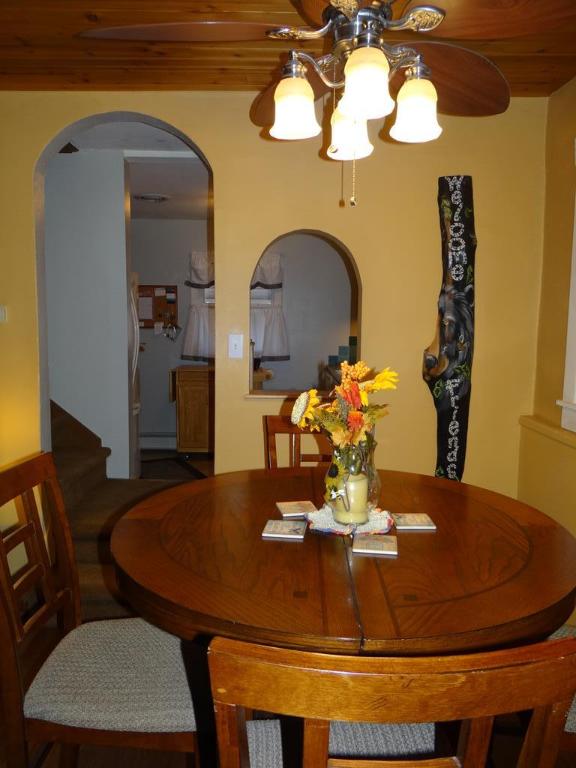 dining area with a baseboard heating unit and wooden ceiling