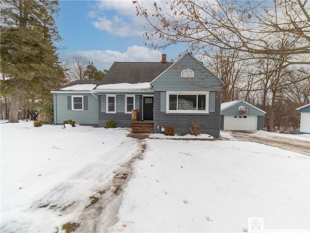 view of front of home featuring a garage and an outdoor structure