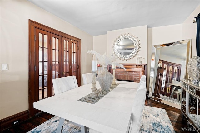 dining space featuring dark wood-type flooring and french doors