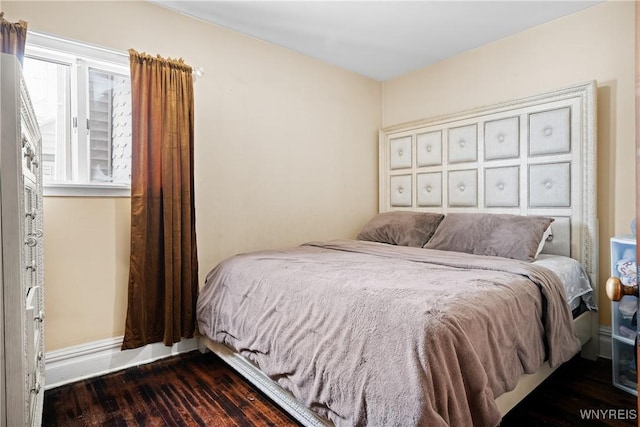 bedroom featuring dark hardwood / wood-style floors