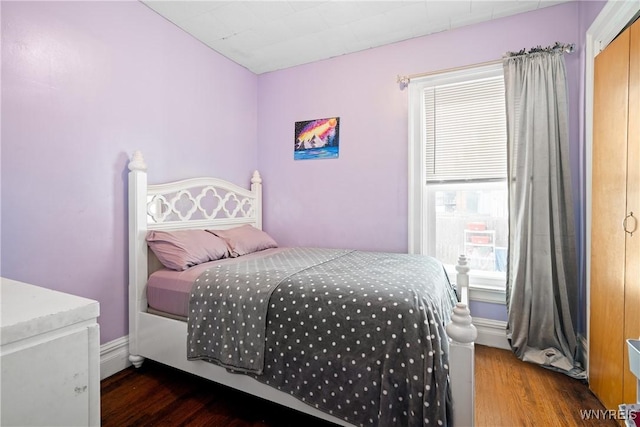 bedroom featuring dark wood-type flooring