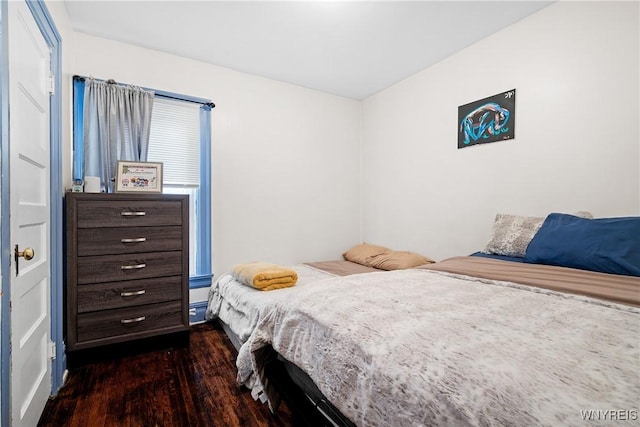 bedroom featuring dark hardwood / wood-style flooring