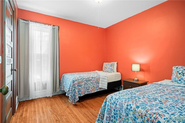 bedroom with light hardwood / wood-style flooring