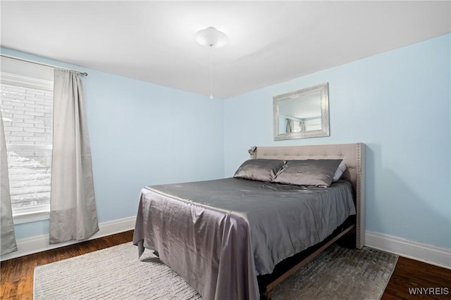 bedroom featuring dark hardwood / wood-style floors