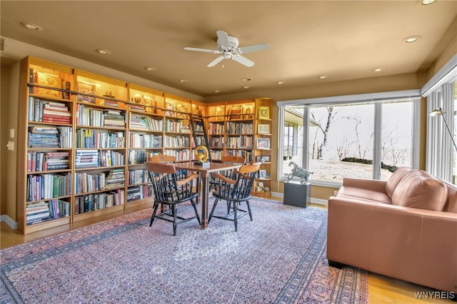 sitting room featuring ceiling fan