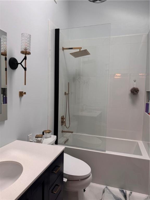 full bathroom with vanity, tiled shower / bath, and toilet