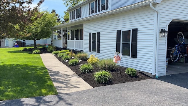 view of property exterior with a yard