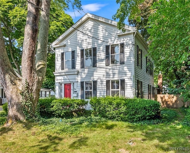 greek revival house with a front yard