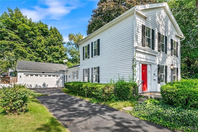 view of front of home with an outbuilding and a garage