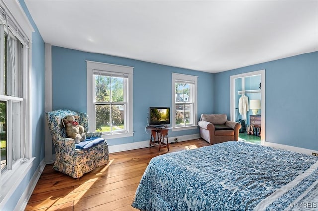 bedroom with light hardwood / wood-style floors