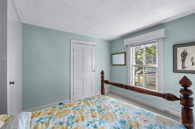 bedroom featuring a textured ceiling