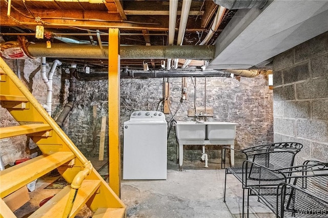 basement featuring washer / clothes dryer and sink