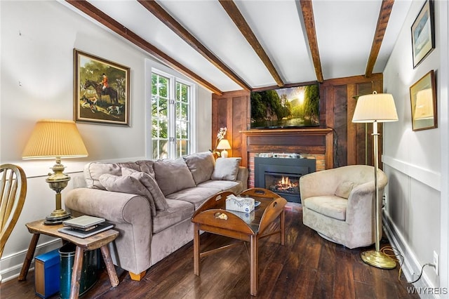 living room with dark wood-type flooring and beam ceiling