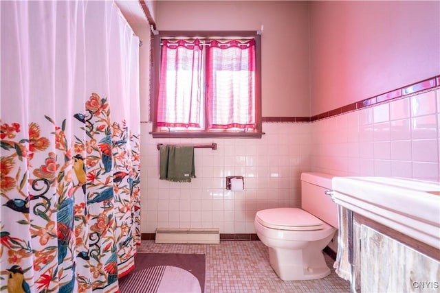 bathroom featuring curtained shower, tile walls, tile patterned flooring, baseboard heating, and toilet