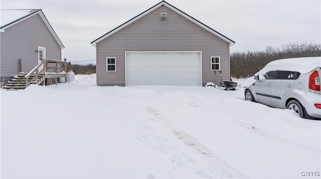 17200 Evans Rd, Hounsfield, NY 13634 - view of snow covered exterior with a garage