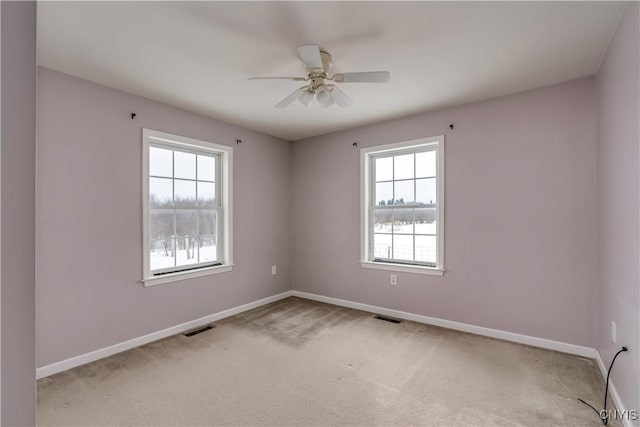 17200 Evans Rd, Hounsfield, NY 13634 - unfurnished room featuring light carpet, a healthy amount of sunlight, and visible vents