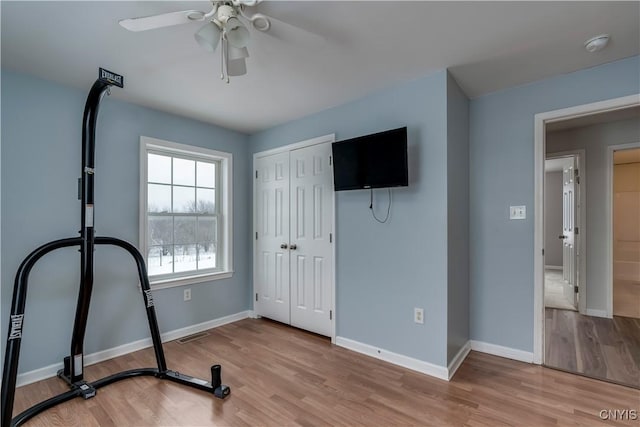 17200 Evans Rd, Hounsfield, NY 13634 - exercise room featuring a ceiling fan, baseboards, light wood-style flooring, and visible vents
