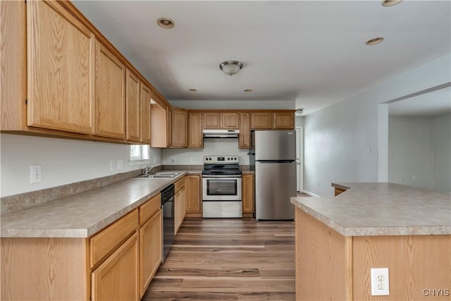17200 Evans Rd, Hounsfield, NY 13634 - kitchen with a sink, under cabinet range hood, light wood finished floors, light countertops, and appliances with stainless steel finishes