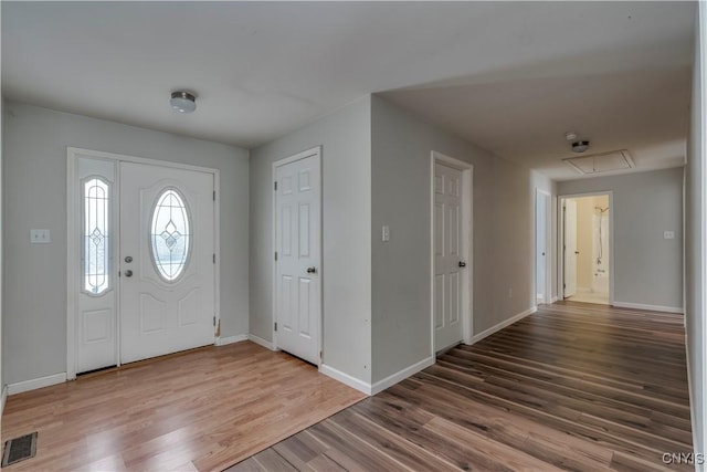 17200 Evans Rd, Hounsfield, NY 13634 - entrance foyer featuring baseboards, visible vents, and wood finished floors