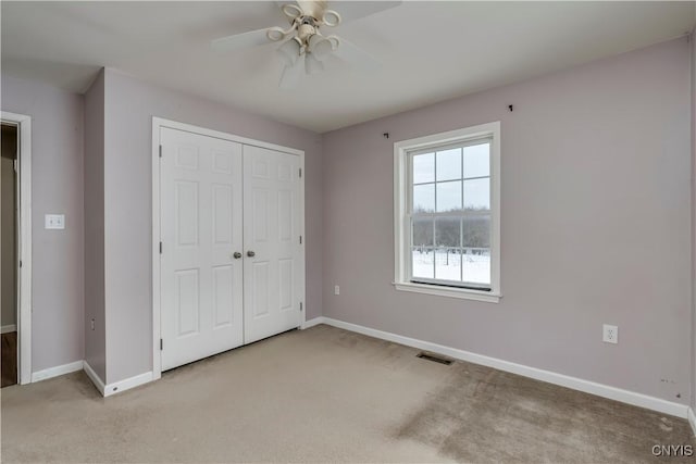 17200 Evans Rd, Hounsfield, NY 13634 - unfurnished bedroom featuring a closet, visible vents, baseboards, and light carpet