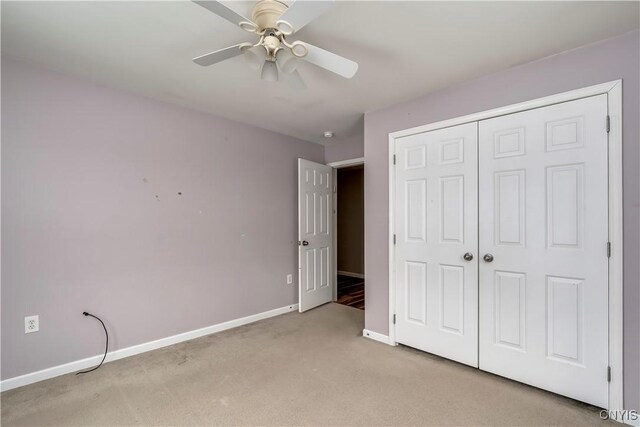 17200 Evans Rd, Hounsfield, NY 13634 - unfurnished bedroom with baseboards, a closet, a ceiling fan, and light colored carpet