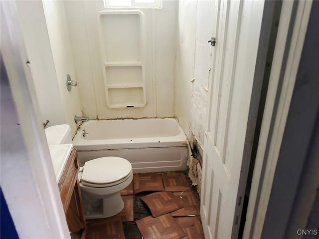 bathroom with vanity, parquet flooring, and toilet