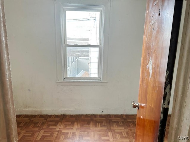 spare room with light parquet flooring