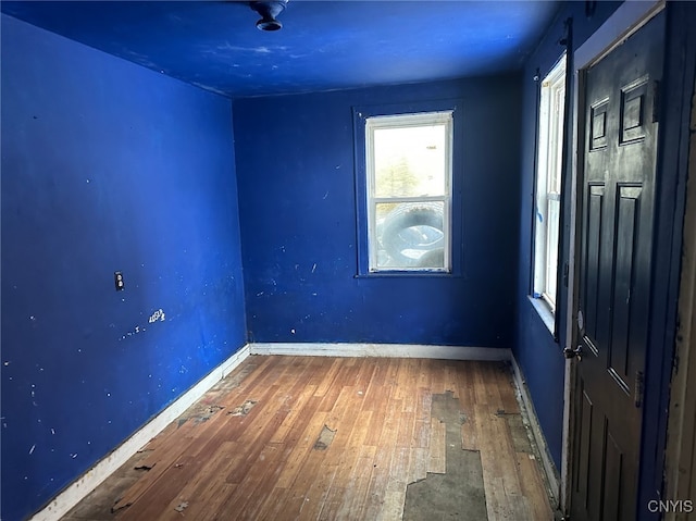 spare room with dark hardwood / wood-style flooring